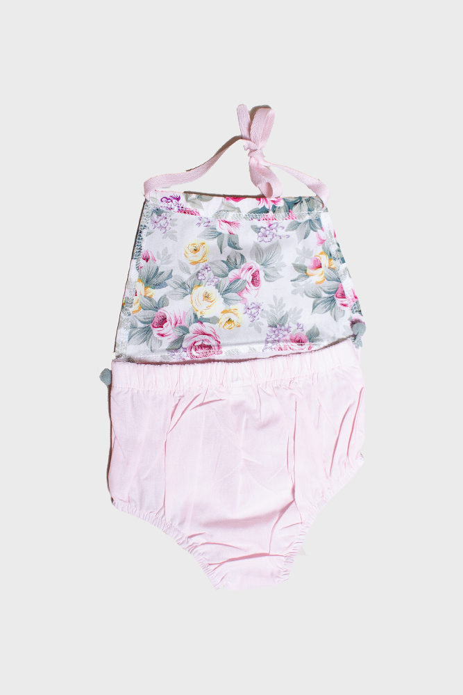 floral baby romper with pom poms