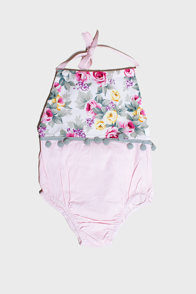 floral baby romper with pom poms